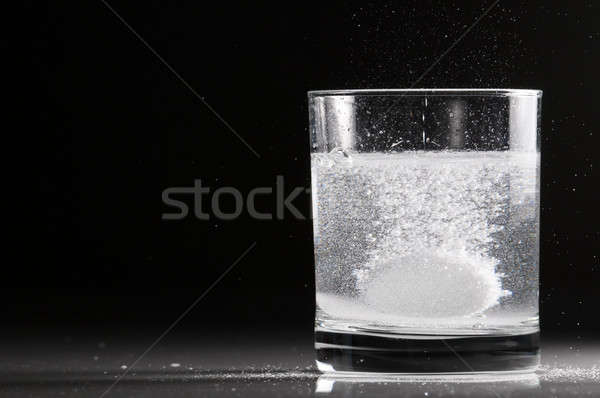 Tabletta üveg víz háttérvilágítás űr fehér Stock fotó © AlessandroZocc