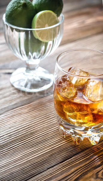 Glass of rum on the wooden background Stock photo © Alex9500