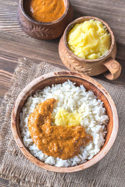 Bowl of rice with Indian butter sauce and Ghee clarified butter Stock photo © Alex9500