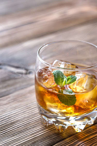 Glass of rum on the wooden background Stock photo © Alex9500