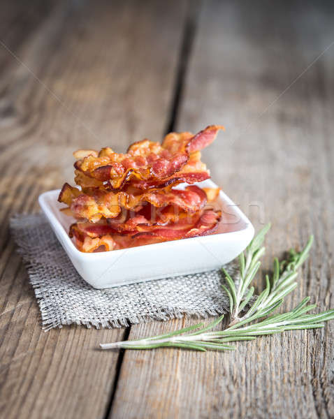Fried bacon strips with fresh rosemary Stock photo © Alex9500