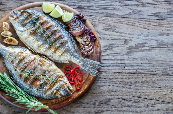 Grilled Dorade Royale Fish on the wooden board Stock photo © Alex9500