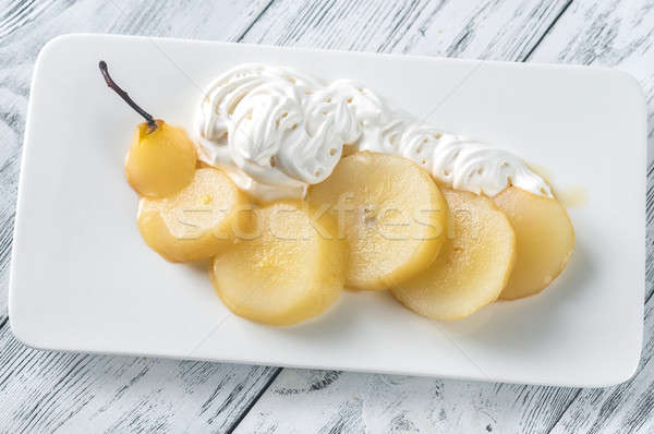 Stock photo: Sliced poached pear with whipped cream