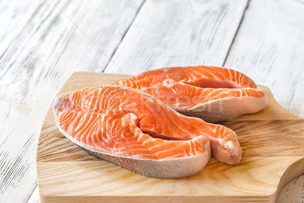 Raw trout steaks on the wooden board Stock photo © Alex9500