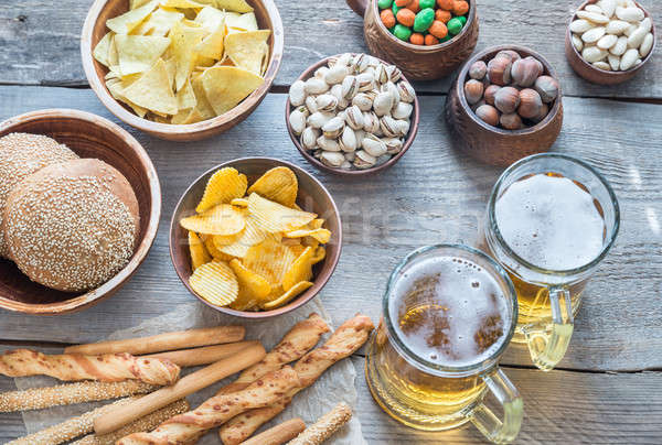 Two glasses of beer with appetizers Stock photo © Alex9500