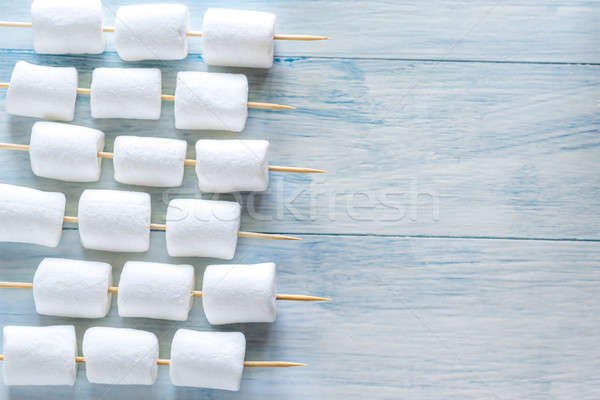 Marshmallow skewers on the wooden background Stock photo © Alex9500