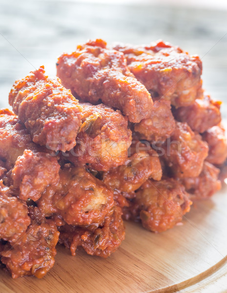 Fried chicken wings on the wooden board Stock photo © Alex9500
