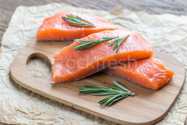 Raw salmon on the wooden board Stock photo © Alex9500