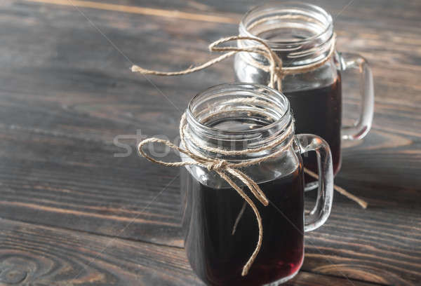 Two glasses of mulled wine on the wooden background Stock photo © Alex9500