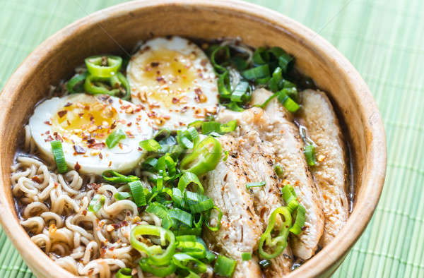 Bowl of chicken ramen soup on the wooden table Stock photo © Alex9500