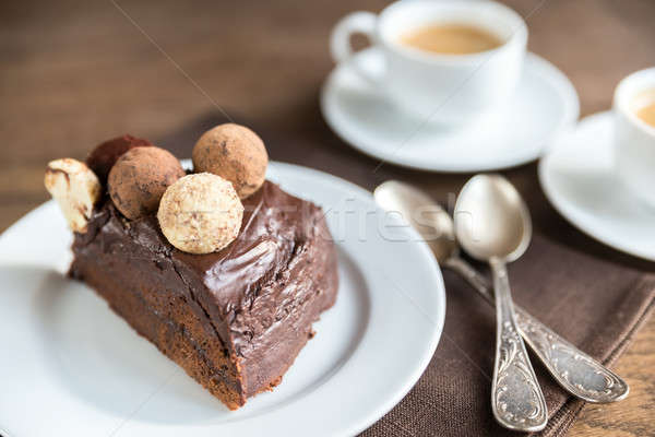 Stock photo: Portion of Sacher torte with two cups of coffee