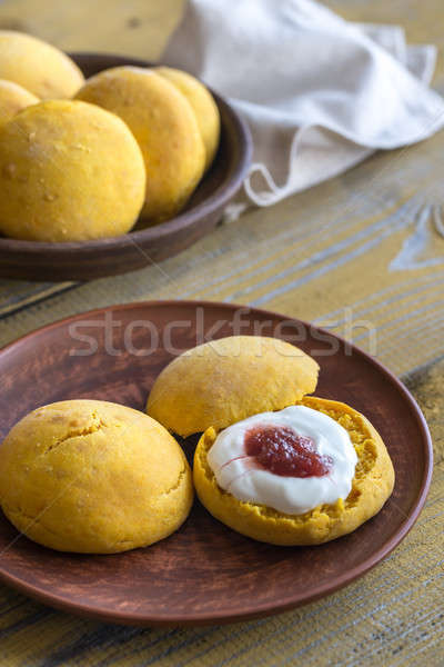 Pumpkin scones with cream and fruit jam Stock photo © Alex9500