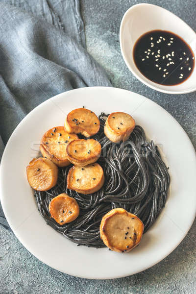 Portion of black pasta with king oyster scallops Stock photo © Alex9500