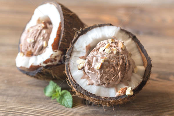 Chocolate ice cream in the coconut halves Stock photo © Alex9500