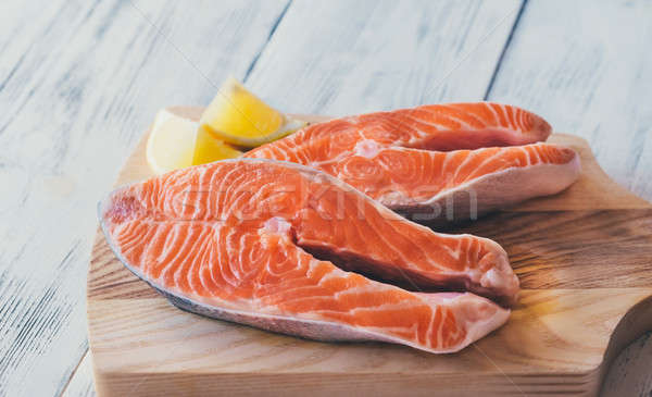 Raw trout steaks on the wooden board Stock photo © Alex9500