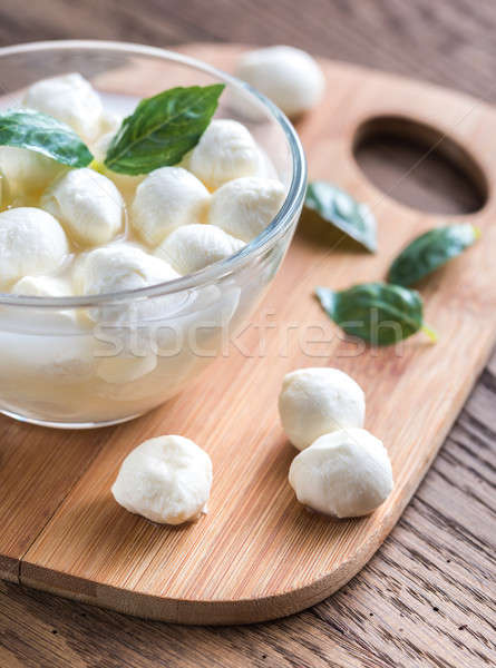 Bowl of Bocconcini mozzarella with fresh basil Stock photo © Alex9500