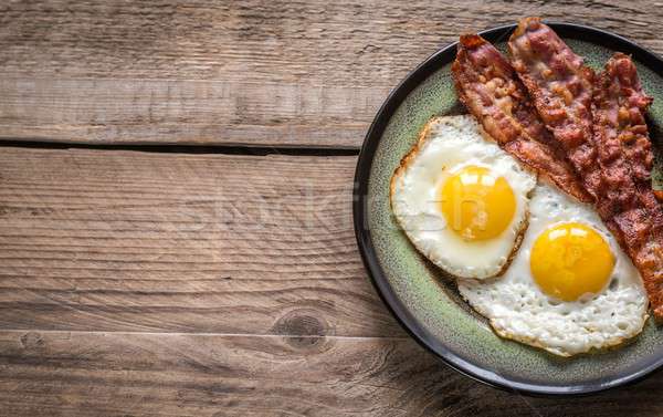 Portion of fried eggs with bacon Stock photo © Alex9500