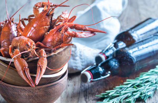 Bowl of boiled crayfish with bottles of beer Stock photo © Alex9500