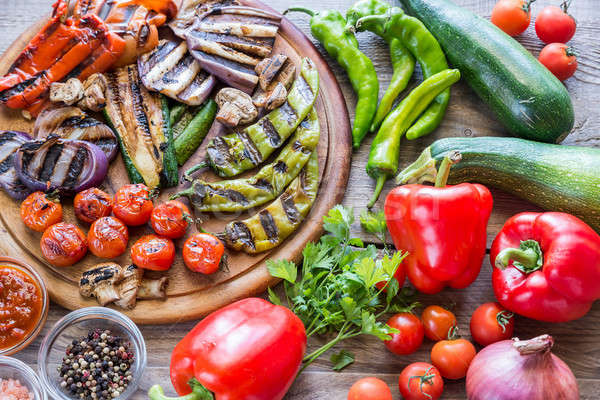 Grilled and fresh vegetables on the wooden board Stock photo © Alex9500