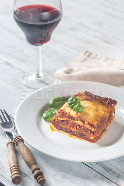Teil Lasagne Glas Wein Holztisch Essen Stock foto © Alex9500