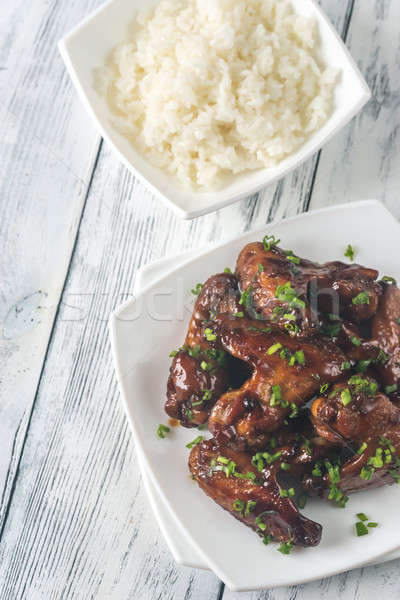 Bowl of teriyaki chicken wings with rice Stock photo © Alex9500