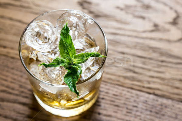 Glass of rum on the wooden background Stock photo © Alex9500