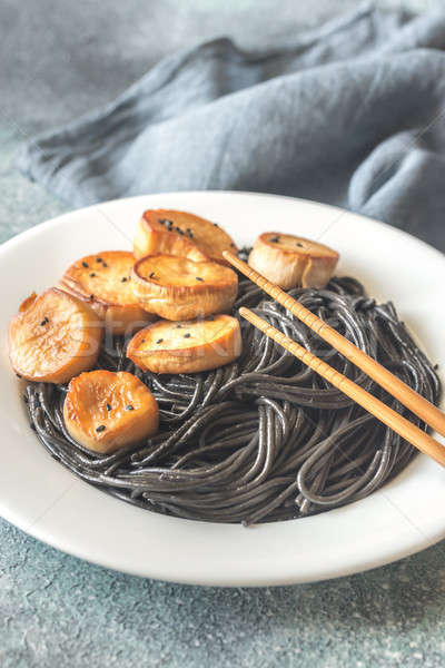 Portion of black pasta with king oyster scallops Stock photo © Alex9500