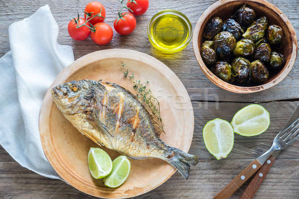 Stock photo: Grilled Dorade Royale Fish with fresh and baked vegetables