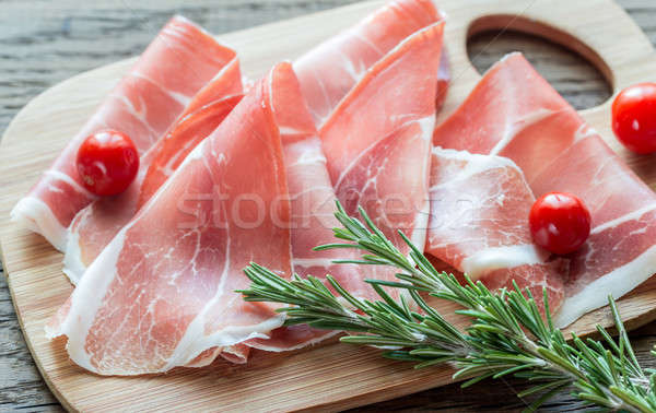 Slices of jamon on the wooden board Stock photo © Alex9500