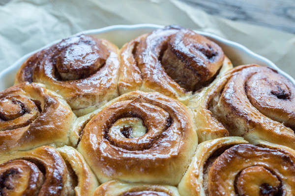 Cinnamon rolls on the wooden background Stock photo © Alex9500