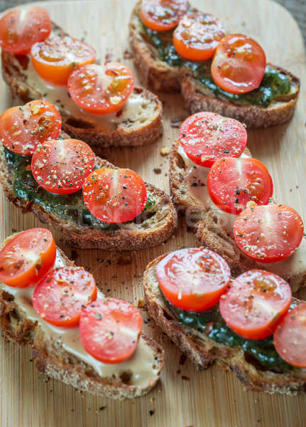 Toasts with tahini and mint sauce and cherry tomatoes Stock photo © Alex9500