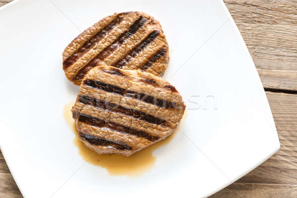 Beef steaks on the white square plate Stock photo © Alex9500