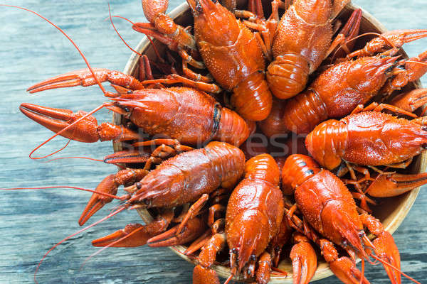 Bowl of boiled crayfish on the wooden table Stock photo © Alex9500