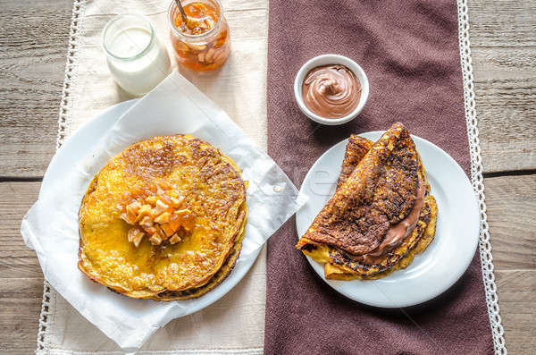 Stock photo: Pumpkin crepes with fruit confiture and chocolate cream