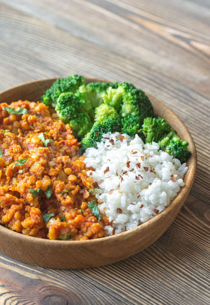 Stock photo: Bowl of red lentil curry with white rice and broccoli