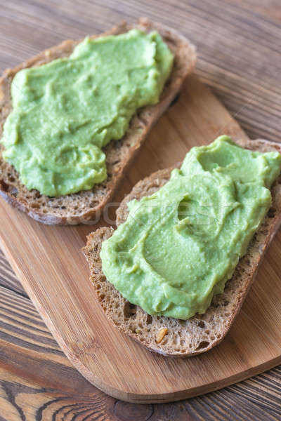 Slices of toasted bread with avocado paste Stock photo © Alex9500