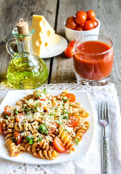 Whole heat fusilli pasta with cheese and cherry tomatoes Stock photo © Alex9500