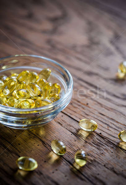 Omega-3 capsules in the glass bowl Stock photo © Alex9500