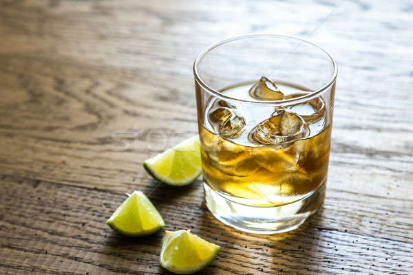 Glass of rum on the wooden background Stock photo © Alex9500