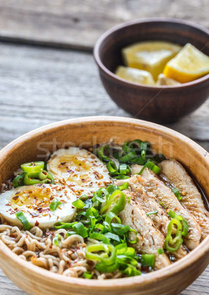 Bowl of chicken ramen soup on the wooden table Stock photo © Alex9500