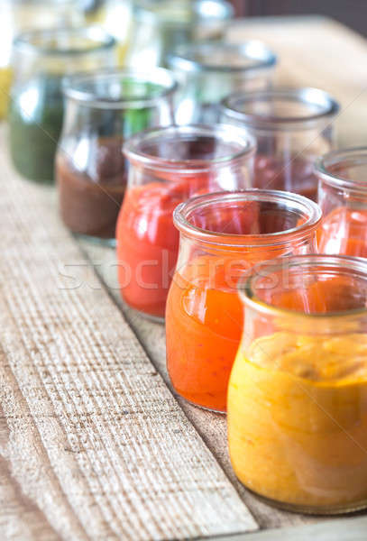 Assortment of sauces in the glass jars Stock photo © Alex9500