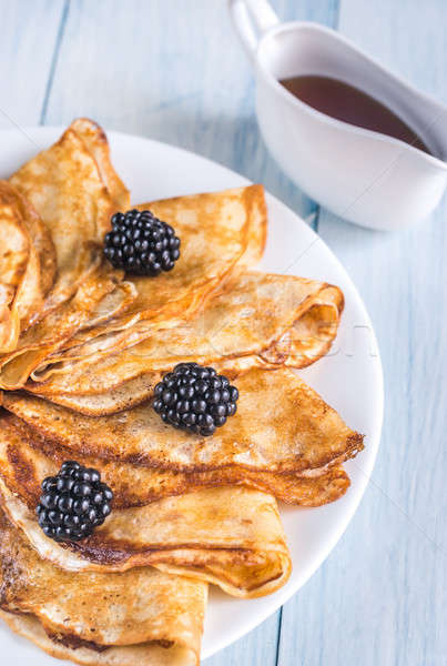 Stock photo: Crepes with blackberries on the wooden table