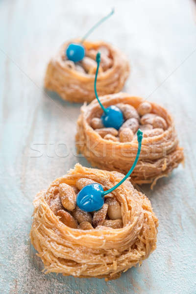 Turkish baklava decorated with cocktail cherries on the wooden b Stock photo © Alex9500