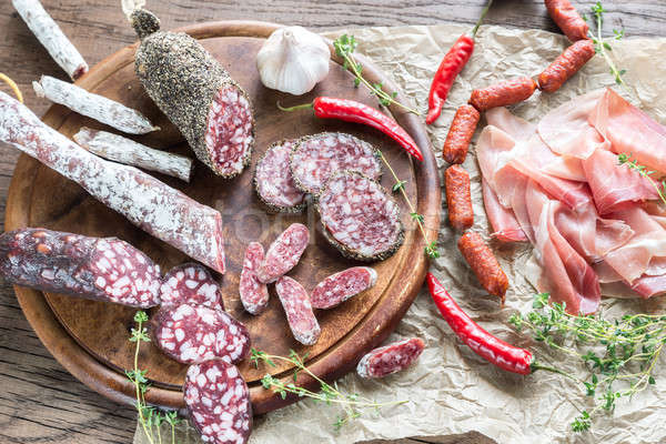 Stock photo: Different kinds of sausage on the wooden background
