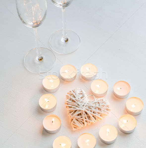 Two glasses with burning candles Stock photo © Alex9500
