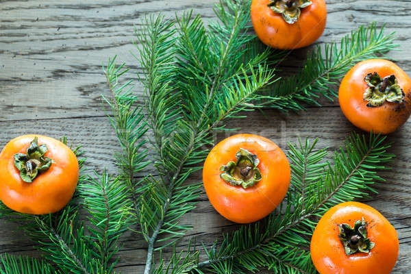 Fresh persimmons with fir branch Stock photo © Alex9500