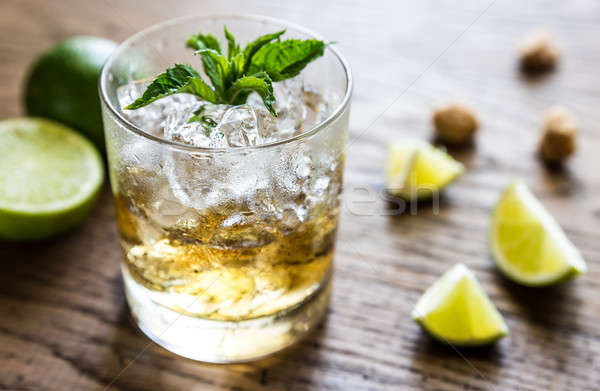 Glass of rum on the wooden background Stock photo © Alex9500