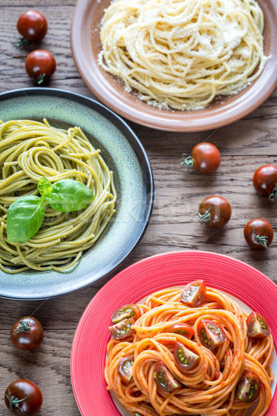 Portions of colorful spaghetti with ingredients Stock photo © Alex9500