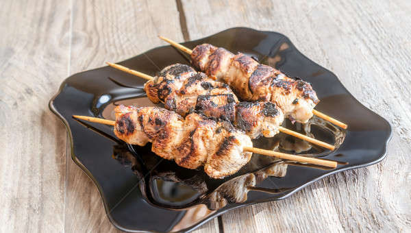 Grilled chicken skewers with spicy sauce Stock photo © Alex9500