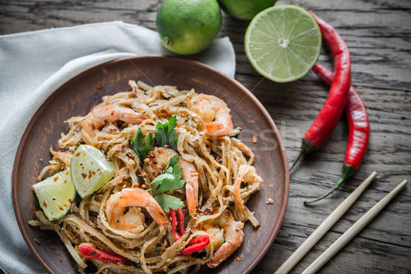 Thai fried rice noodles with shrimps Stock photo © Alex9500